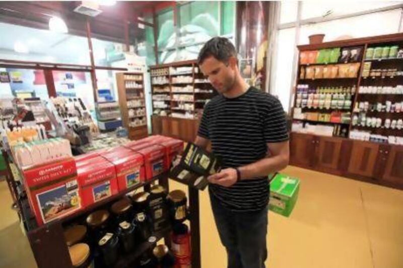 Sean Penny at the supplements section of an organic supermarket in Dubai. Satish Kumar / The National