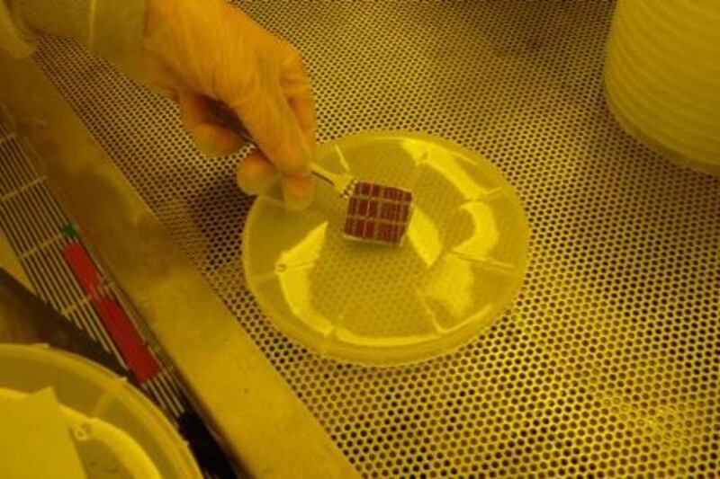 The thin-film solar cells in a “clean room” at Massachusetts Institute of Technology, where Masdar Institute scientists are developing cells that will produce double the amount of energy compared with other cells. Courtesy Masdar Institute