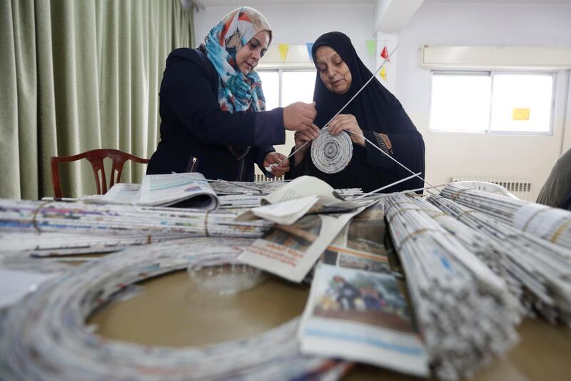 Creatively inclined women recycle newspapers and magazines to create pieces of art and furniture in Amman, Jordan. Reuters