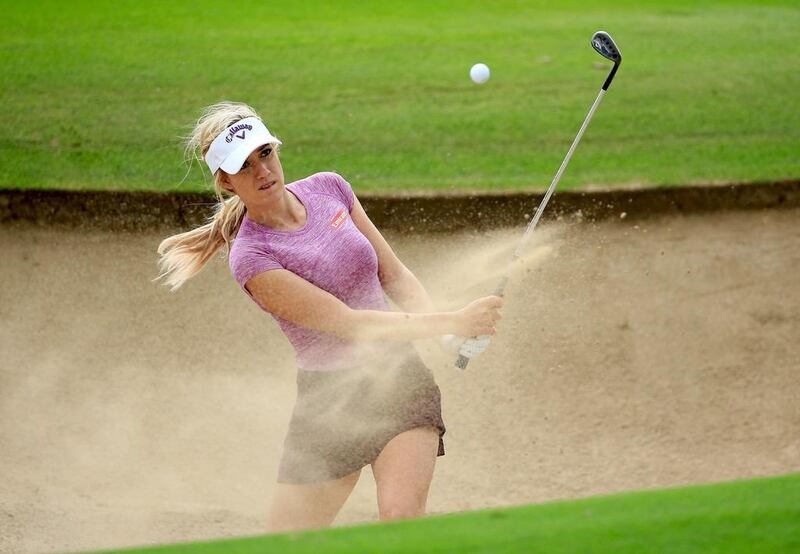 American Paige Spiranac hits out of a bunker during a practice round at the Emirates Golf Club in Dubai on Monday. David Cannon / Getty Images

