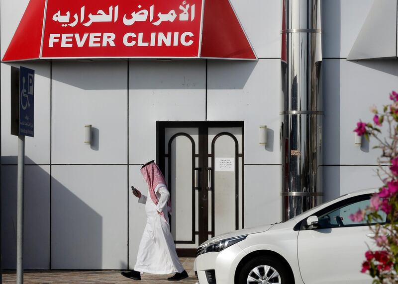 A Saudi man walks in front of a fever clinic serving individuals showing Covid-19 symptoms in Jeddah, Saudi Arabia. AP Photo