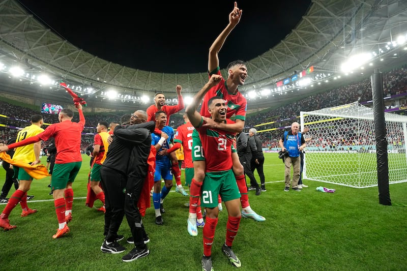 Morocco's players celebrate after another stunning win at the World Cup. AP Photo