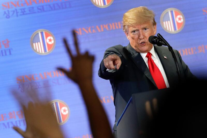 U.S. President Donald Trump answers questions about the summit with North Korea leader Kim Jong Un during a press conference at the Capella resort on Sentosa Island Tuesday, June 12, 2018 in Singapore. Trumpâ€™s comments on Tuesday that North Korea was destroying a major missile engine testing site seemed to support a recent U.S. study that the country was razing a facility that had been crucial to its development of mid-range solid-fuel missiles. (AP Photo/Wong Maye-E)