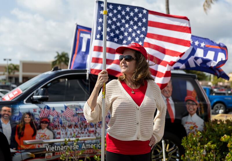 A woman attends a rally for former president Donald Trump on Monday in West Palm Beach, Florida. AP