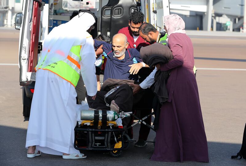 Medical staff help a Palestinian patient into an ambulance