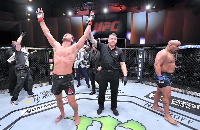 LAS VEGAS, NEVADA - AUGUST 15: In this handout image provided by UFC, Stipe Miocic celebrates after his victory over Daniel Cormier in their UFC heavyweight championship bout during the UFC 252 event at UFC APEX on August 15, 2020 in Las Vegas, Nevada. (Photo by Jeff Bottari/Zuffa LLC via Getty Images)