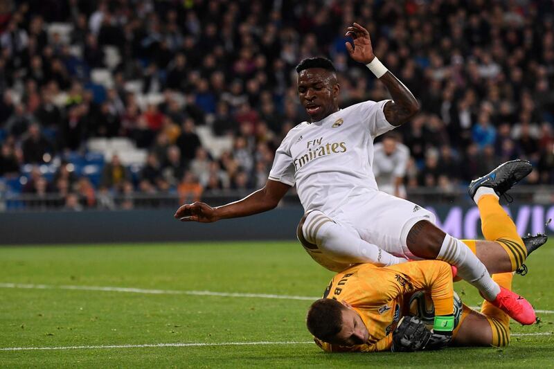 Real Madrid's Brazilian forward Vinicius Junior challenges Celta Vigo's Spanish goalkeeper Ruben Blanco. AFP