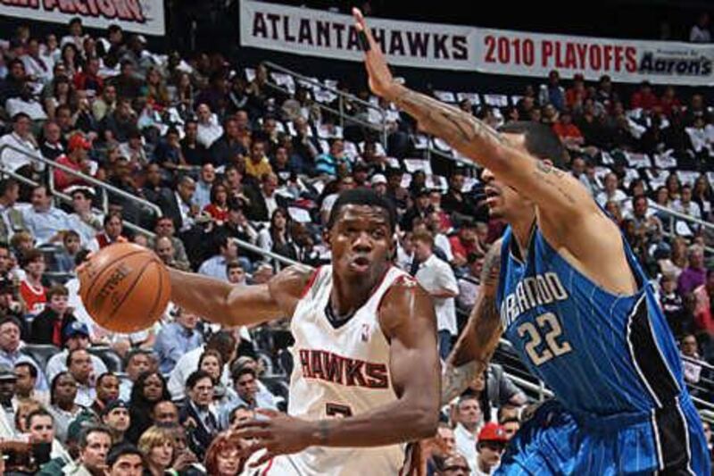 Joe Johnson, left, chose to remain in Atlanta over moving to New York, where he would have been reunited with Mike D'Antoni, his former coach in Phoenix.