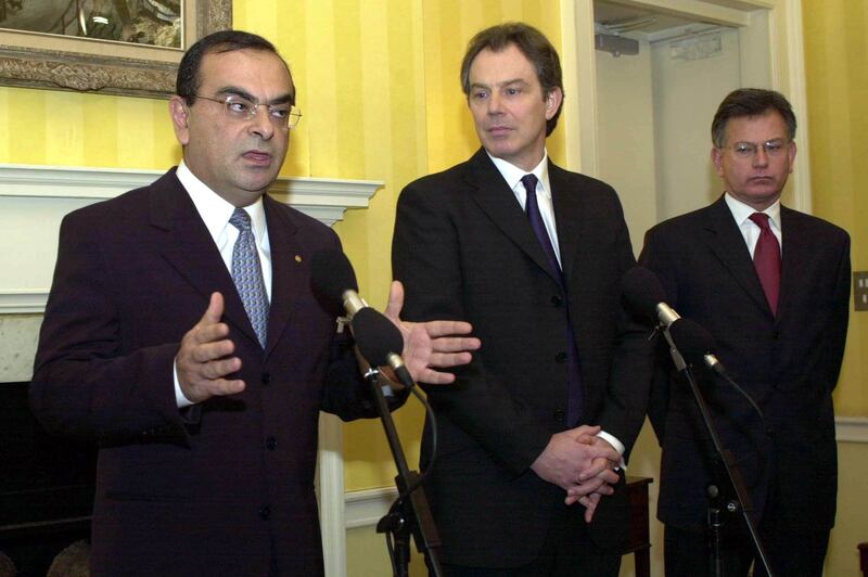 Mr Ghosn, British prime minister Tony Blair and trade secretary Stephen Byers, right, announce the expansion of the carmaker's plant in Sunderland in January 2001. Getty Images