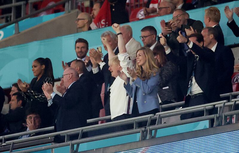 Mr and Mrs Johnson celebrate England's second goal during the UEFA Euro 2020 Championship semi-final match between England and Denmark at Wembley Stadium on July 7.