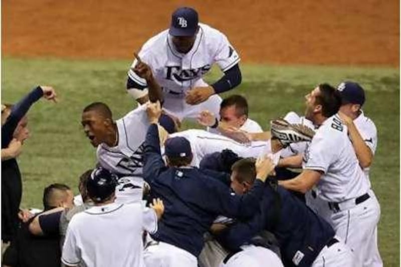 The Tampa Bay Rays celebrate their series victory against Boston at the end of Game Seven.
