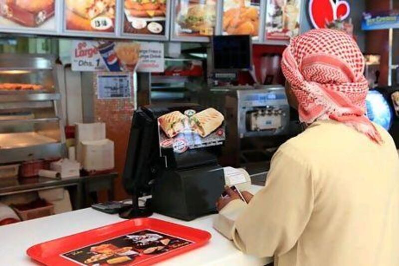 Of the teenagers questioned across Abu Dhabi and Dubai, 24 per cent said their favourite brand was KFC. Ravindranath K / The National
