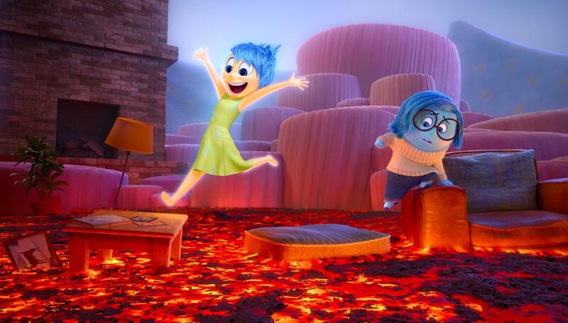 Joy, left, voiced by Amy Poehler, and Sadness, voiced by Phyllis Smith, in Inside Out. Courtesy Disney / Pixar