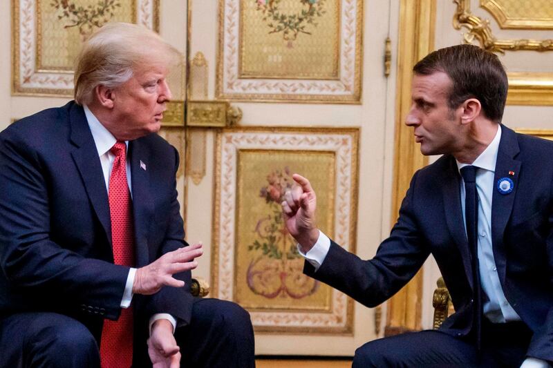 (FILES) In this file photo taken on November 10, 2018 US President Donald Trump (L) speaks with French president Emmanuel Macron prior to their meeting at the Elysee Palace in Paris, on the sidelines of commemorations marking the 100th anniversary of the 11 November 1918 armistice, ending World War I.  US President Donald Trump mocked Emmanuel Macron November 13, 2018 for his "very low" 26 percent approval rating, saying the French president only suggested creating a European army to "get onto another subject." "The problem is that Emmanuel suffers from a very low Approval Rating in France," Trump tweeted after criticizing Macron for advocating a European army to protect the continent from Russia, China and the United States."By the way, there is no country more Nationalist than France, very proud people-and rightfully so!" the US leader tweeted. "MAKE FRANCE GREAT AGAIN!" 
 / AFP / Christophe Petit-Tesson
