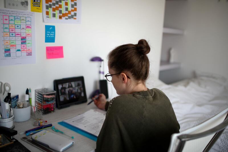 FILE PHOTO: Lise, a student at the International Bilingual School (EIB), attends her online lessons in her bedroom in Paris as a lockdown is imposed to slow the rate of the coronavirus disease (COVID-19) spread in France, March 20, 2020. Picture taken on March 20, 2020. REUTERS/Gonzalo Fuentes/File Photo