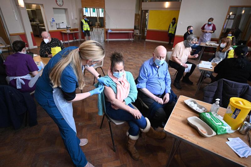 Doses of the of Oxford-AstraZeneca vaccine are administered to patients at the vaccination centre set up at St Columba's church in Sheffield. AFP