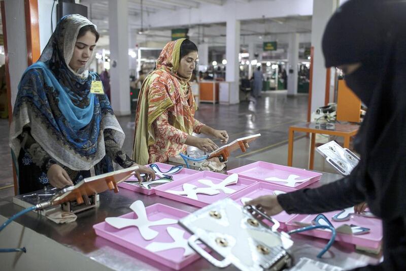 Employees at the factory in Sialkot, Punjab province. Reuters