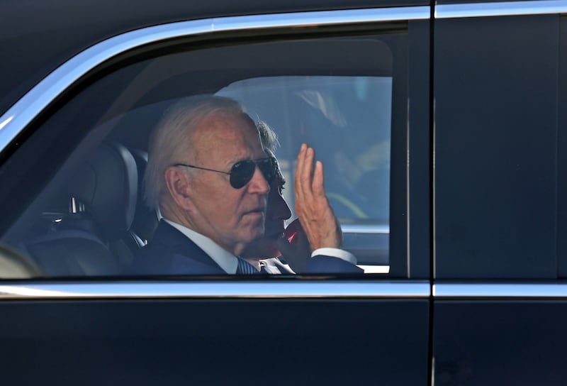 US President Joe Biden waves as he leaves Israel's Ben Gurion Airport on his way to Jerusalem.  EPA 