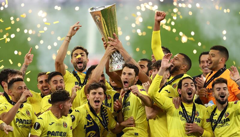 Villarreal players celebrate with the trophy after winning the Europa League final. EPA