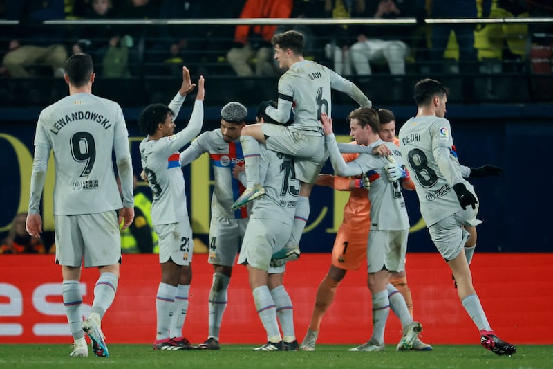 Barcelona players celebrate victory at the end of the match against Villarreal. AFP