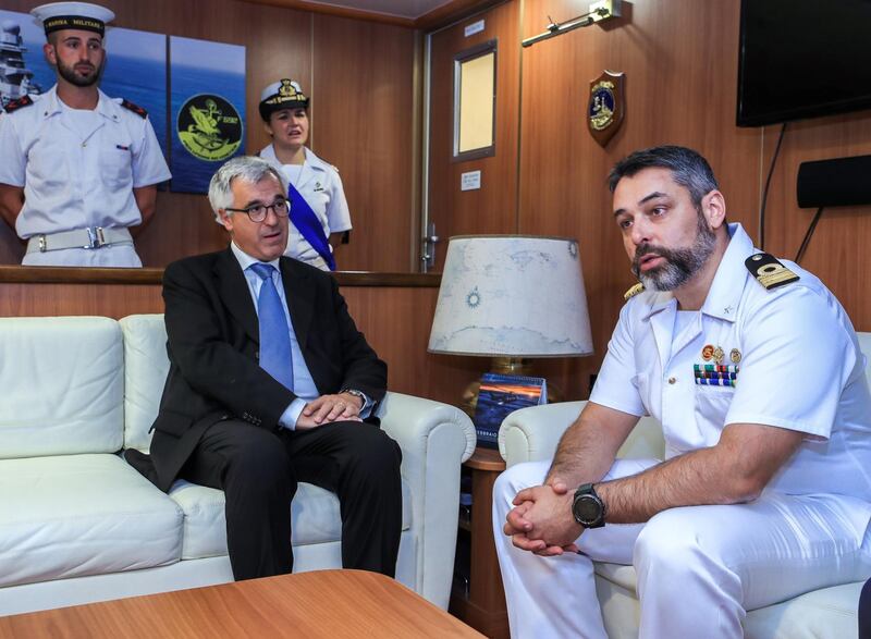 Abu Dhabi, U.A.E., February 14, 2019.  European Multi-Mission Frigate (FREMM), Carlo Margottini has docked at the Abu Dhabi Port with Commander Marco Guerriero.  -- (R-L)  Commander Marco Guerriero welcomes Ambassador  Liborio Stellino to the frigate.
Victor Besa/The National
Section:  NA
Reporter:  Charlie Mitchell