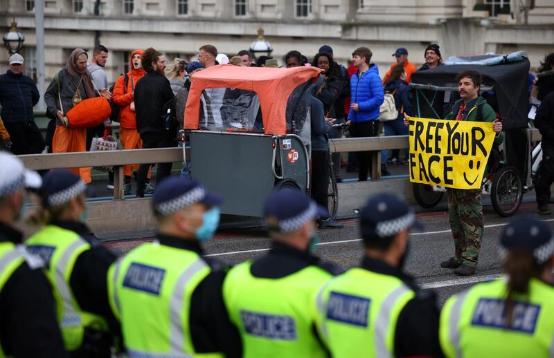 Anti-lockdown protesters take part in a march in London. Reuters