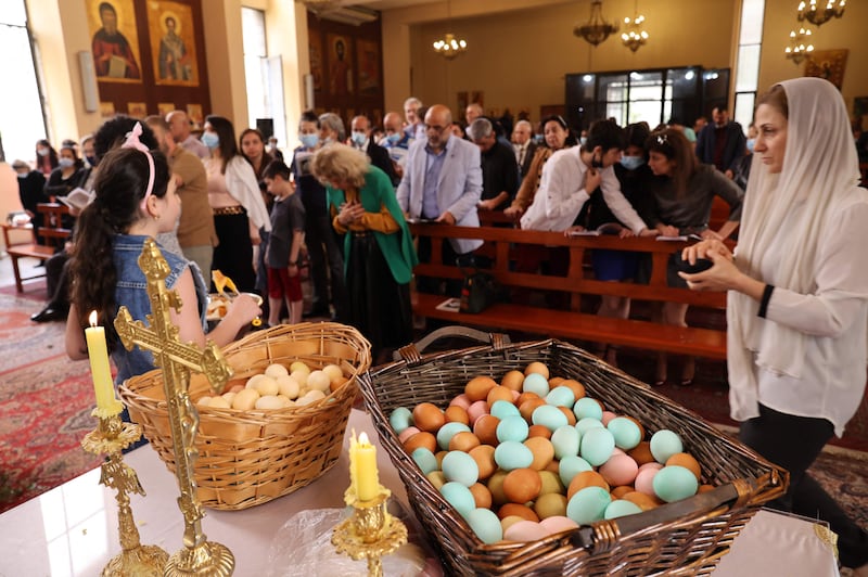 Coloured eggs are kept in baskets before being distributed during Easter celebrations at the Church of Our Lady of Protection in the Sin El-Fil neighbourhood of Beirut on April 17, 2022. AFP