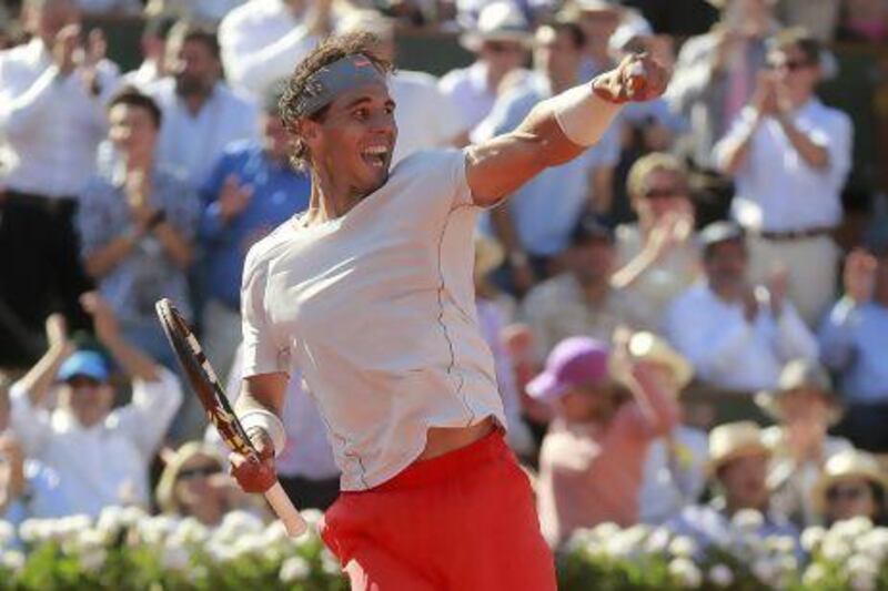 Rafael Nadal of Spain celebrates defeating Novak Djokovic.