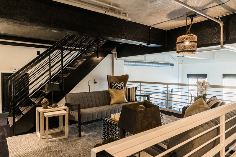 There is an additional lounge area on the staircase landing. Photo: Douglas Elliman Realty