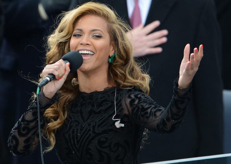Beyoncé and her large mic. AFP / Stan Honda