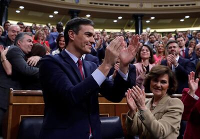 Spain's caretaker Prime Minister Pedro Sanchez applauds at the Spanish parliament in Madrid Tuesday, Jan. 7, 2020. Spain's parliament chose Socialist leader Pedro SÃ¡nchez to form a new government Tuesday, ending almost a year of political limbo for the eurozone's fourth-largest economy. SÃ¡nchez won a cliff-hanger confidence vote 167-165, with 18 abstentions. It was the slimmest victory for a prime minister candidate in decades.(AP Photo/Manu Fernandez)