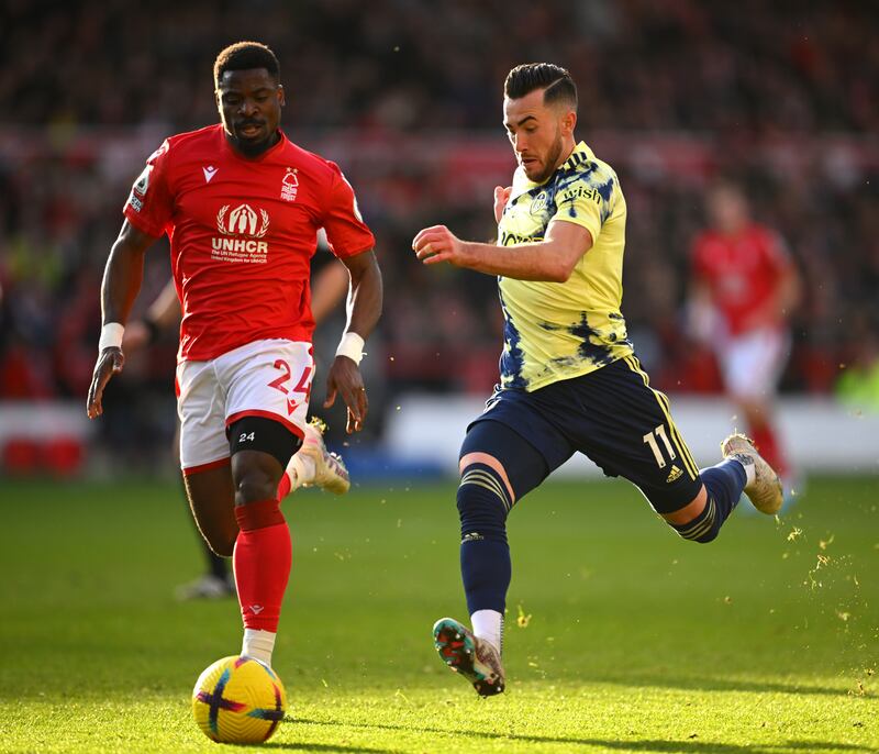 Jack Harrison of Leeds United battles for possession with Serge Aurier of Nottingham Forest. Getty