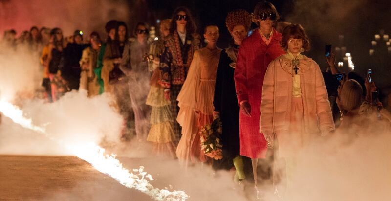 The cruise 2019 show was staged in Alyscamps, the ancient graveyard of Arles in France, lit entirely by flames. Photo: Gucci