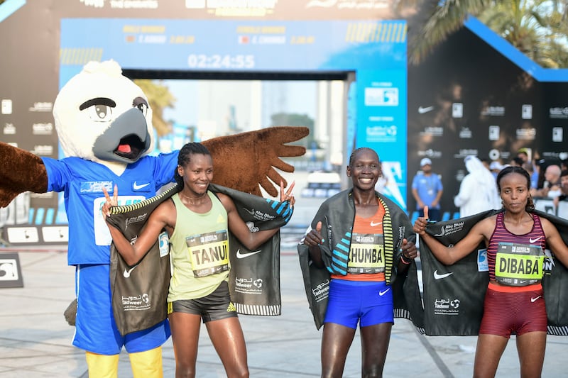 Elite women's race winner Eunice Chumba of Bahrain with Kenya's Angela Tanui and Mare Dibaba at the Adnoc Abu Dhabi Marathon on Saturday, December 17, 2022. All images Khushnum Bhandari / The National 