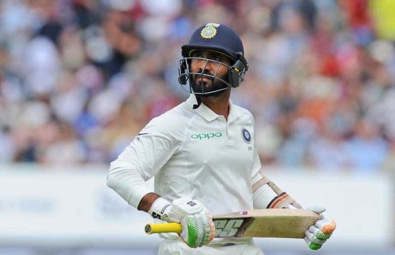 India's Dinesh Karthik leaves the field after being dismissed during the second day of the first test cricket match between England and India at Edgbaston in Birmingham, England, Thursday, Aug. 2, 2018. (AP Photo/Rui Vieira)