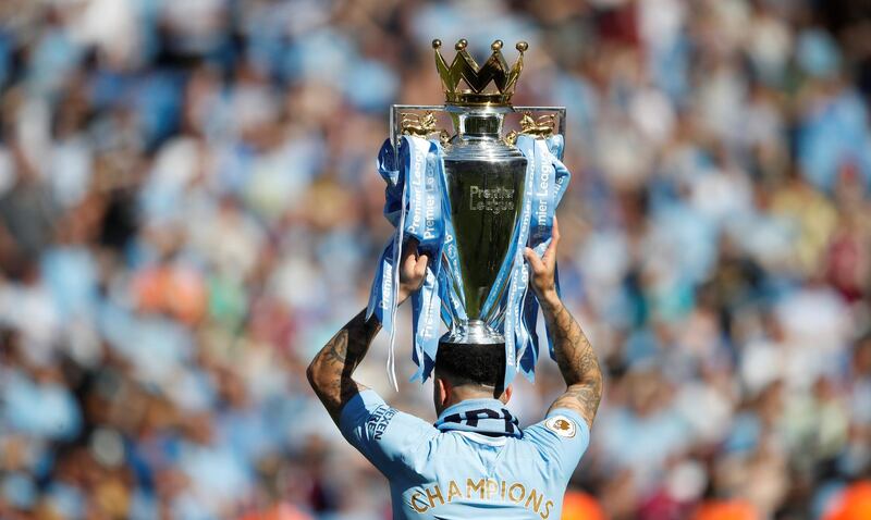 Manchester City's Kyle Walker celebrates with the trophy after winning the Premier League title. Carl Recine / Action Images via Reuters