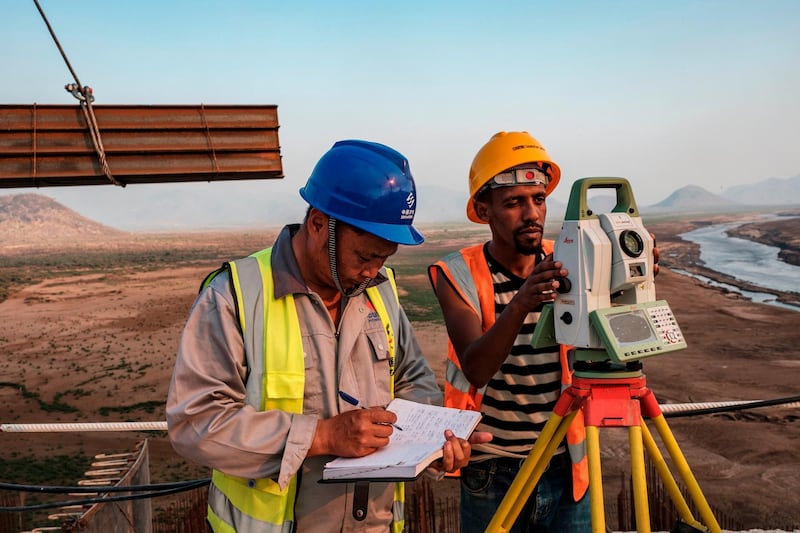 Workers perform measurements at the Grand Ethiopian Renaissance Dam (GERD),  near Guba in Ethiopia. AFP