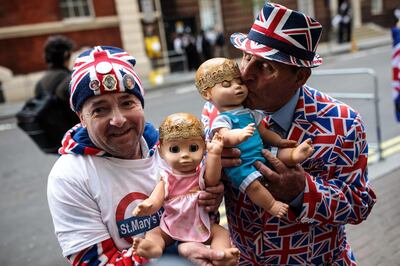 LONDON, ENGLAND - APRIL 23: Royal fans John Loughrey (L) and Terry Hutt (R) pose with baby dolls outside the Lindo Wing of St Mary's Hospital ahead of the birth of the Duke & Duchess of Cambridge's third child on April 23, 2018 in London, England. Catherine, Duchess of Cambridge has this morning been admitted to hospital in the early stages of labour.  (Photo by Jack Taylor/Getty Images)