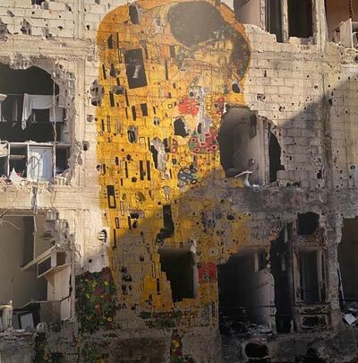 Many thought Tammam Azzam's 'Freedom Graffiti', 2013, was a real image of Gustav Klimt's 'The Kiss' graffitied onto a ravaged building in Syria. However, it was photoshopped in Dubai. Courtesy Middle East Institute