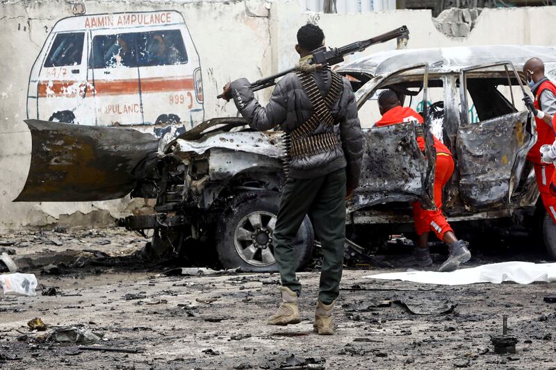 A police officer keeps watch following a suicide car bomb explosion in Mogadishu, Somalia. The British defence secretary has warned of a rise in Al Shabab attacks. Reuters.
