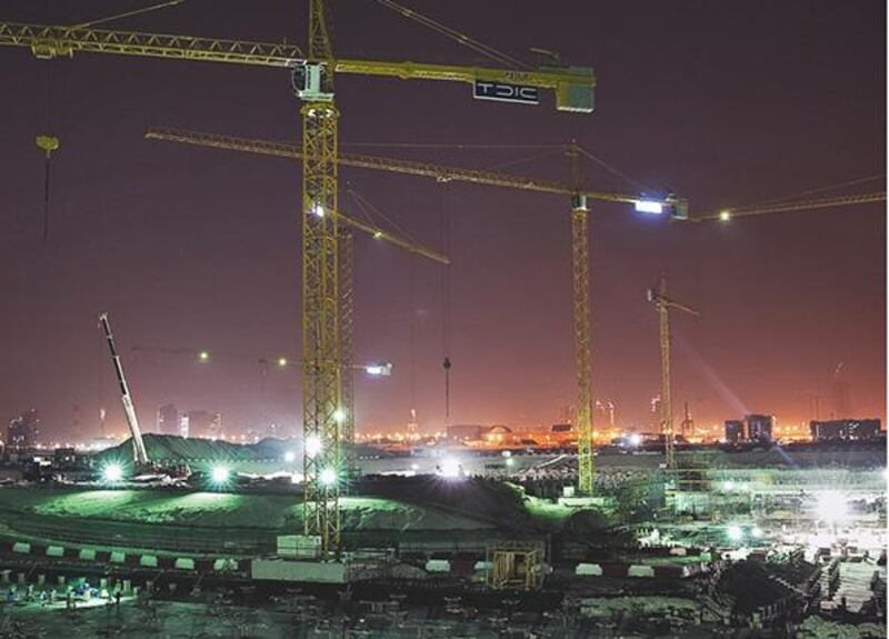 Construction on the Louvre Abu Dhabi goes on night and day on Saadiyat Island. Silvia Razgova / The National