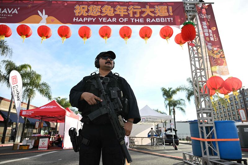 Police at the scene of the mass shooting. Ten people died and at least 10 others were wounded in the largely Asian city in southern California. AFP