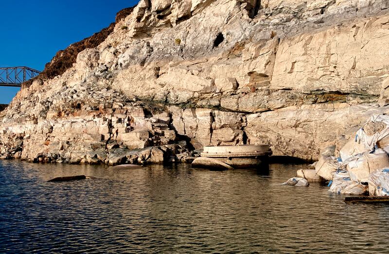 Detectives probing the mystery say the contents of the container point to its having been in the huge reservoir since the 1980s.   (Southern Nevada Water Authority / AP