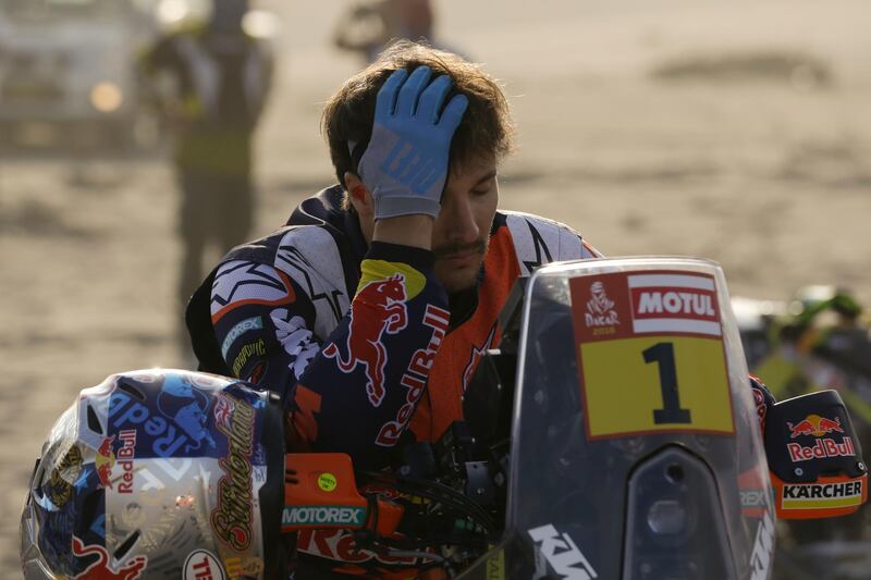 Sam Sunderland, of United Kingdom, sits on his KTM motorbike prior to the start of the 4th stage of the 2018 Dakar Rally in San Juan de Marcona, Peru, Tuesday, Jan. 9, 2018. The ruling champion suffered an accident during the stage and quit the race. (AP Photo/Ricardo Mazalan)