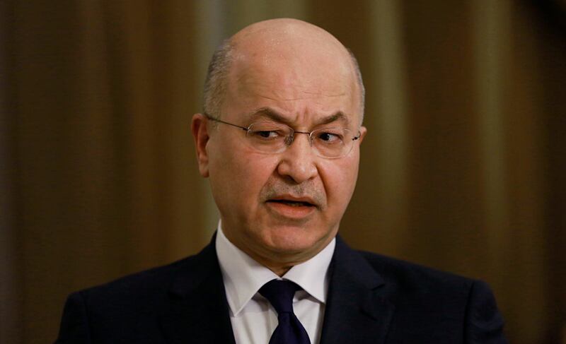 Iraq's President Barham Salih speaks during an interview with The Associated Press in Baghdad, Iraq, Friday, March 29, 2019. Salih says he does not see any "serious" opposition when it comes to the presence of American forces in Iraq as long as they are there for the specific mission of assisting in the fight against the Islamic State group. (AP Photo/Khalid Mohammed)