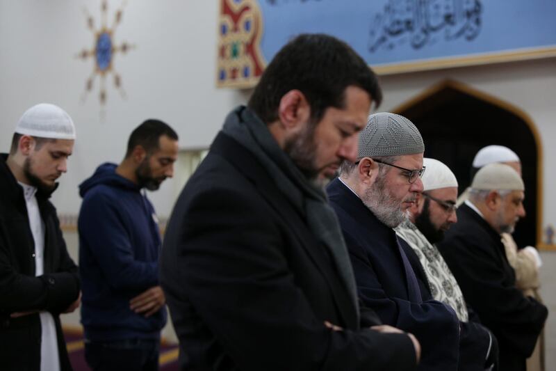 (Left to right) Sheik Khaled Zreika and Sheikh Yahya Safi, Imam of Lakemba Mosque pray with members of the community during a live online prayer event at Lakemba Mosque in Sydney, Australia. Getty Images