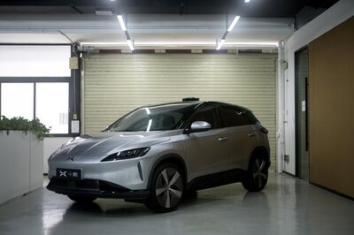 An Xpeng Motors Technology Ltd. G3 sport utility vehicle (SUV) sits parked at the company's headquarters in Guangzhou, China, on Wednesday, June 6, 2018. Though Xpeng hasn't delivered a single vehicle, doesn't own a factory and hasn't obtained a production license from the government, the Chinese electric automaker expects to raise more than $600 million this month from investors that include Alibaba, valuing it close to $4 billion, according to a person familiar with the fundraising. Photographer: Giulia Marchi/Bloomberg