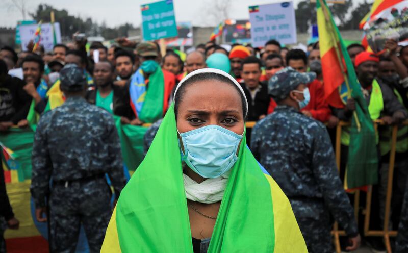 A woman draped in the national flag attends a pro-government rally in Meskel Square in Addis Ababa, Ethiopia, to celebrate the second filling of the Great Ethiopian Renaissance Dam being built on the Nile River and to condemn the Tigray People's Liberation Front,