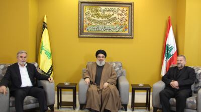 Hezbollah leader Hassan Nasrallah meets Palestinian Islamic Jihad head Ziad Al Nakhala and Hamas's deputy chief Saleh Al Arouri at an undisclosed location in Lebanon. AFP