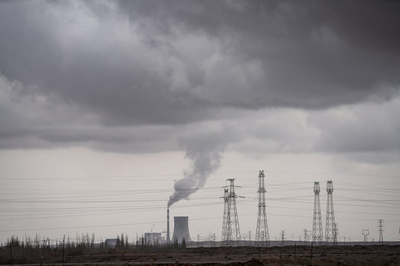 A coal-fired power plant on the outskirts of the new city area of Yumen, Gansu province, China, on Wednesday, March 31, 2021. Yumen, "the cradle of China's oil industry," has become a totem for China's changes over the past four decades—from a time of sacrifice and ideology to one of entrepreneurs and the pursuit of wealth, from the old economy to the new, from fossil fuels to renewable energy. Photographer: Qilai Shen/Bloomberg
